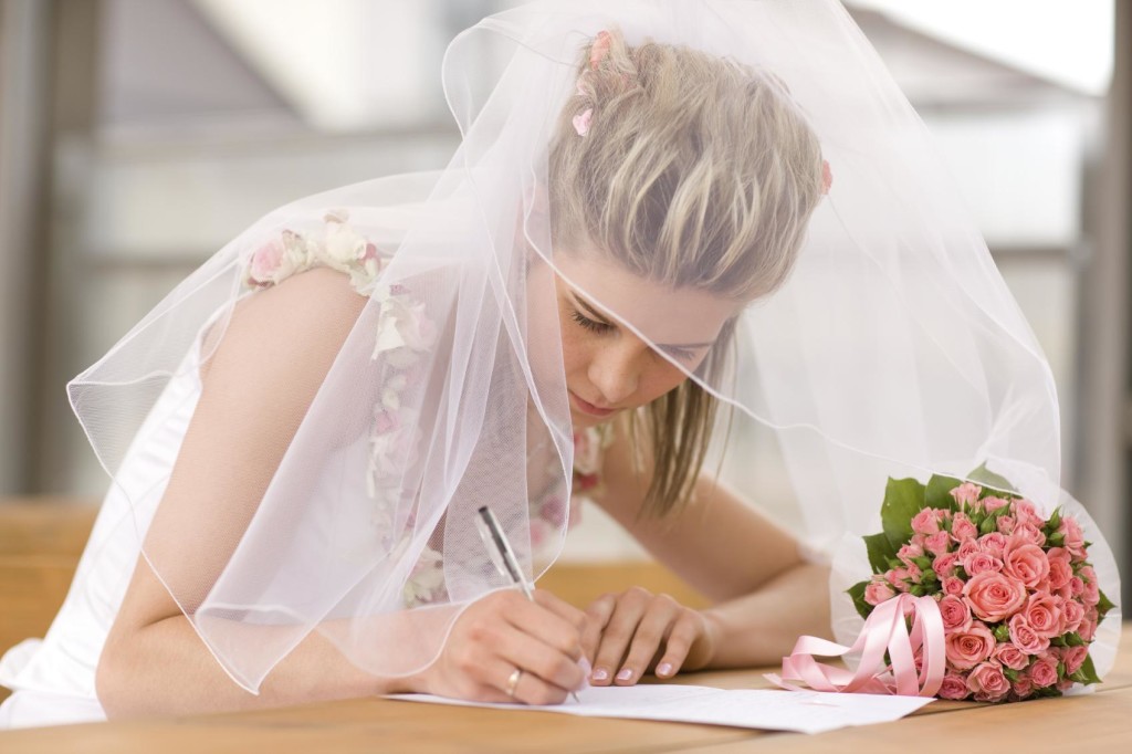 Beautiful bride sign up marriage certificate